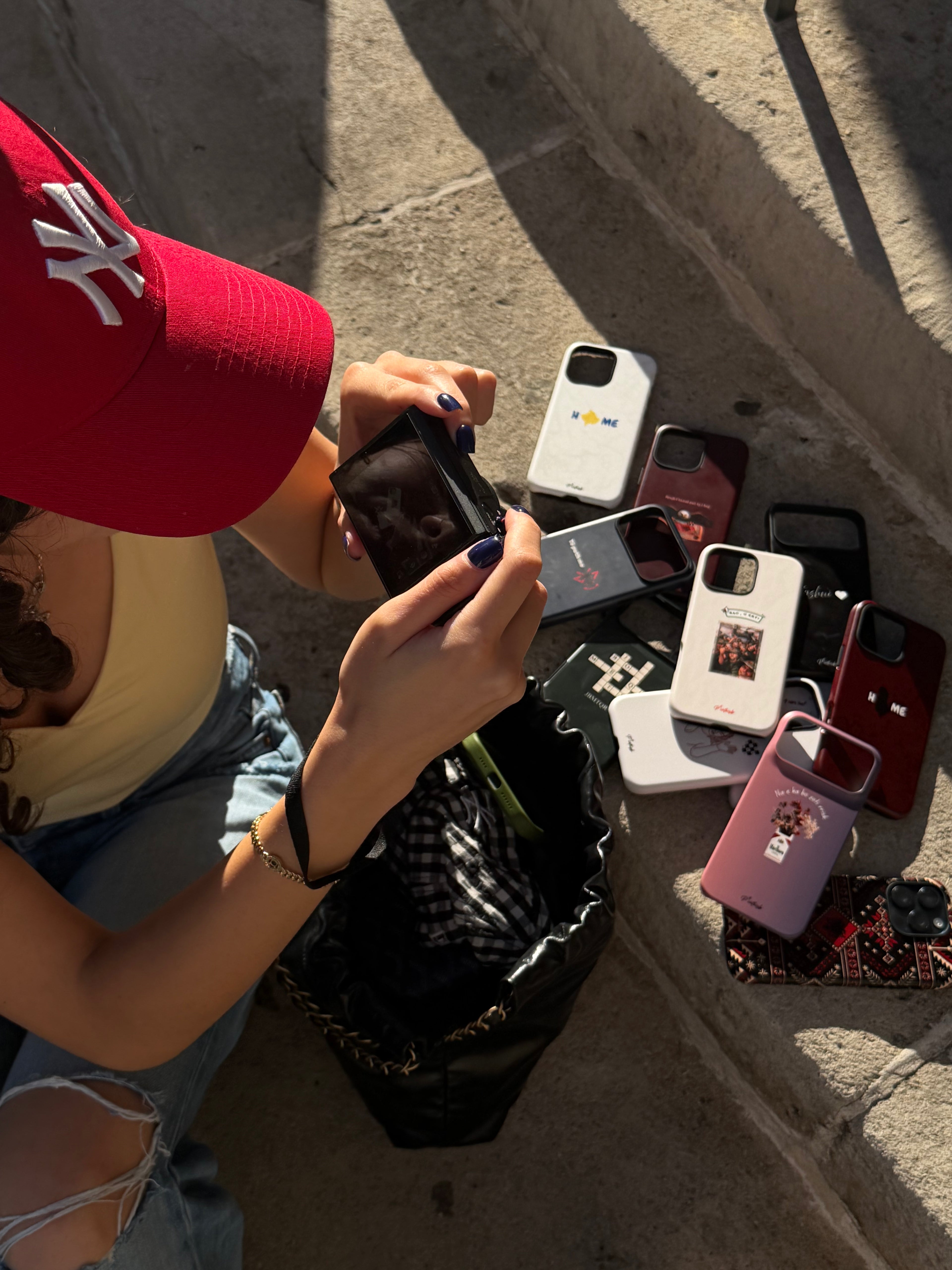 girl taking pictures of the best phone cases ever