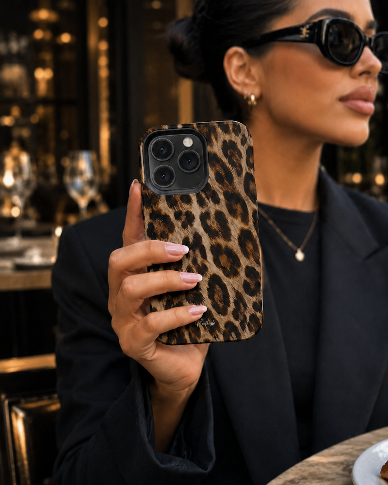 woman holding the nicest leopard print phone case